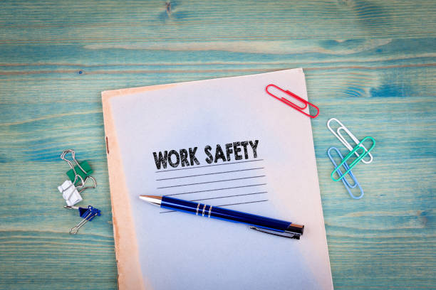 istock work safety concept. Notebook on a bright green background. Office stationery accessories 828151266