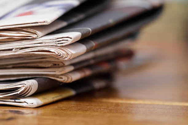 istock Stack of newspaper extreme close up with copy space 828151830