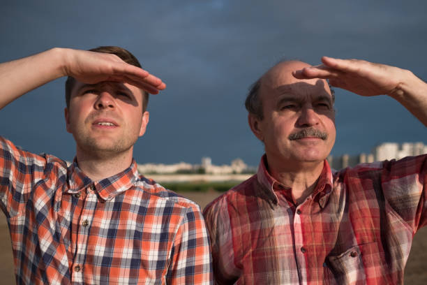 istock Casual middle aged men looking far away 828152188