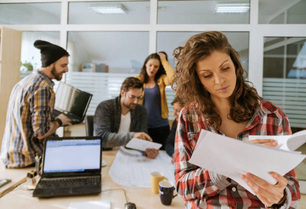 istock Start Up Team Of Freelancers In The Office 828154540