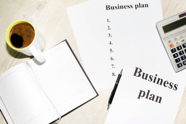 istock An inscription of the business plan, execution points, there is a calculator next to it 828154858