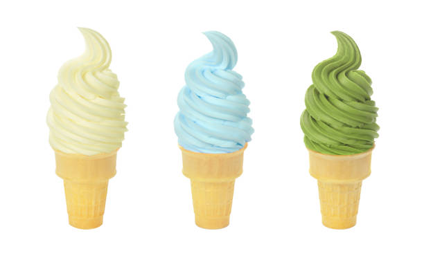 Three Flavors of Frozen Yogurt or Soft Serve Ice Cream Cones on White Background