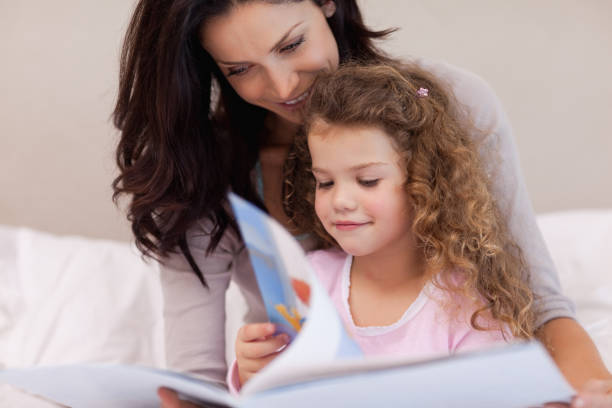 istock Mother reading a book with her daughter 828168662