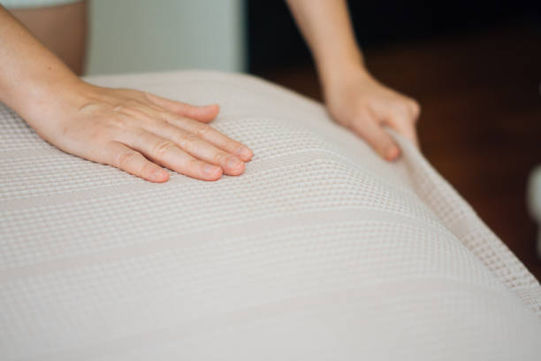 istock Woman Hands making a room bed 828174988
