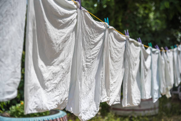 istock Washed pillowcase hanging on rope and dry in the sun 828182746