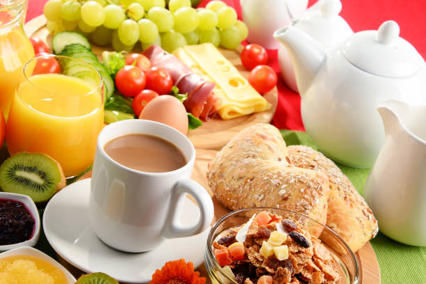 istock Breakfast served with coffee, orange juice, egg and fruits 828183840