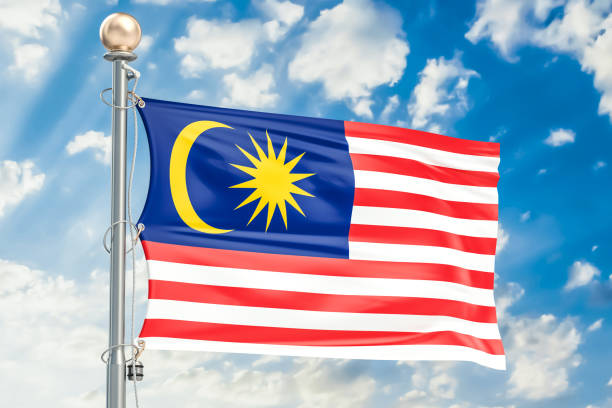 istock Malaysian flag waving in blue cloudy sky, 3D rendering 828204592