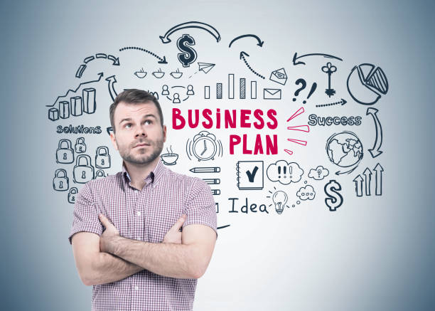 istock Bearded man in a shirt and a business plan 828208884