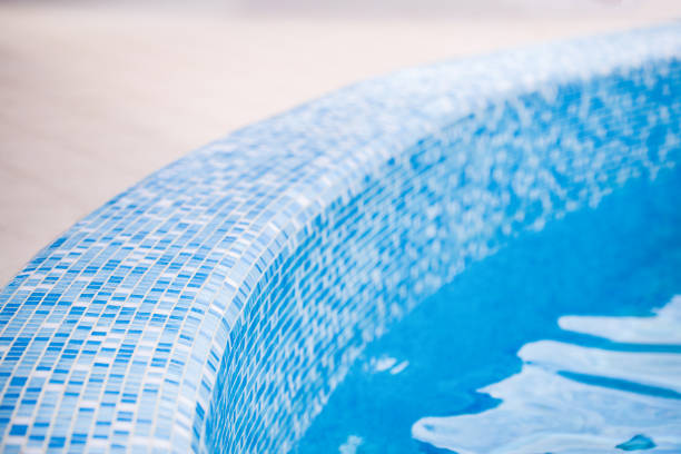 Beautiful curved edge of a swimming pool at a resort or spa.