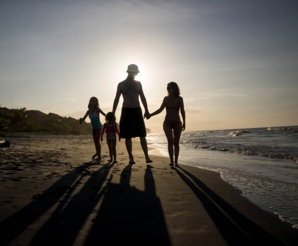 istock Happy family on vacations at the beach 828219732
