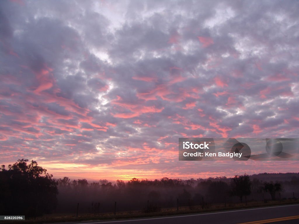 Sunrise over the Brooksville Ridge Fiery clouds at sunrise in rural Central Florida Atmospheric Mood Stock Photo
