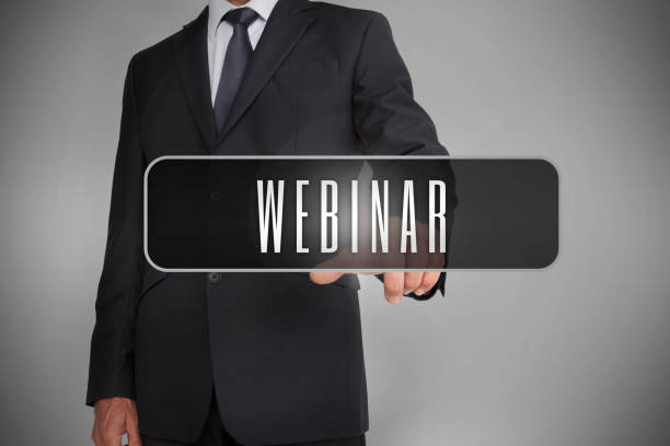 istock Businessman selecting label with webinar written on it 828225274