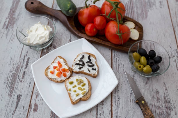 istock Butter and bread for breakfast, over rustic wooden background close up 828235834
