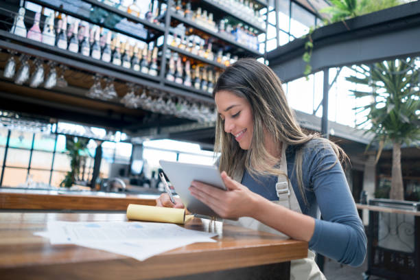 istock Business owner doing the books at a restaurant 828241398