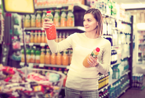 istock female shopper searching for beverages 828249444