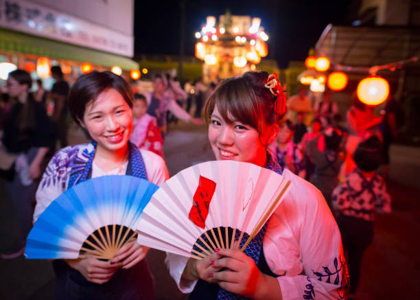 istock Young matsuri dancers posing in front of dashi float 828257456