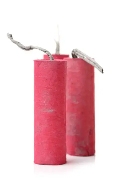 Photo of Red firecrackers isolated on white background.Firecracker