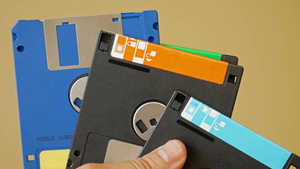 istock Office man clerk with floppy disks on his hand 828267430