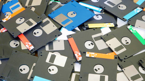 istock Obsolete floppy disks on office desk 828269624
