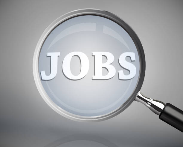 istock Magnifying glass showing jobs word in white 828271418