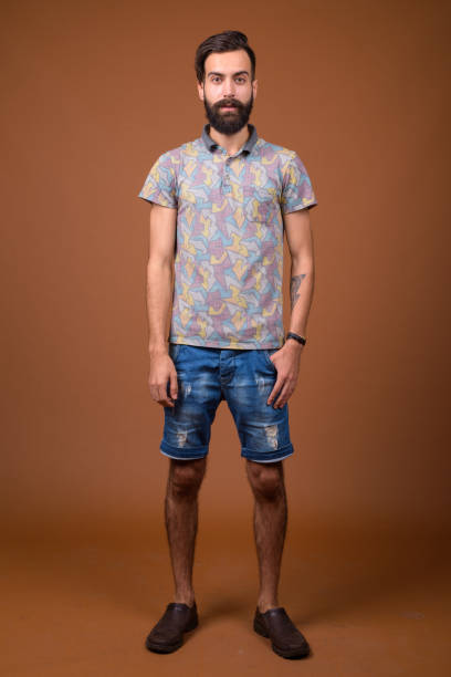 istock Studio shot of young handsome bearded Persian man against colored background 828287610