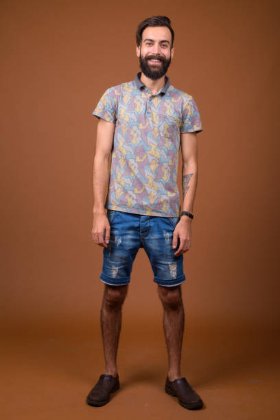 istock Studio shot of young handsome bearded Persian man against colored background 828287714
