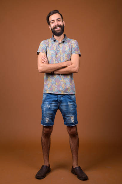 istock Studio shot of young handsome bearded Persian man against colored background 828287812