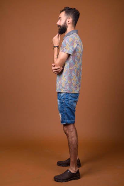 istock Studio shot of young handsome bearded Persian man against colored background 828287906