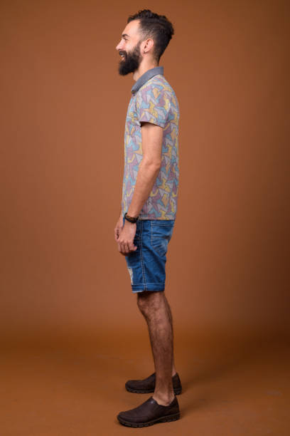 istock Studio shot of young handsome bearded Persian man against colored background 828287912