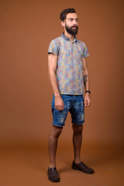 istock Studio shot of young handsome bearded Persian man against colored background 828287966