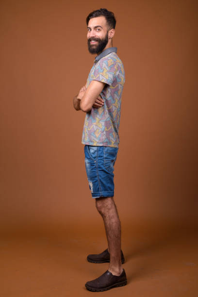 istock Studio shot of young handsome bearded Persian man against colored background 828287968