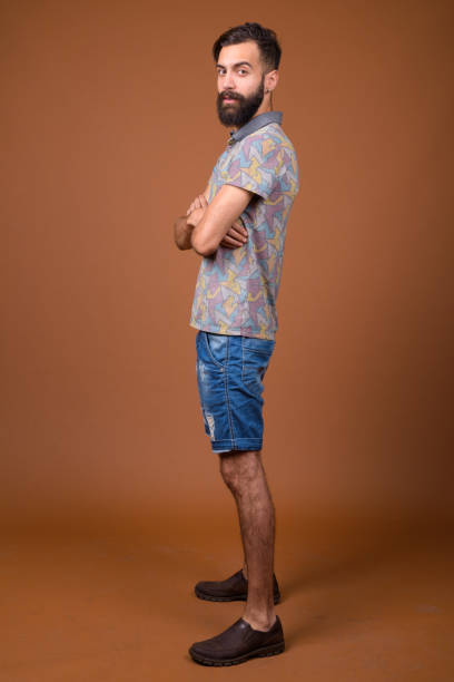 istock Studio shot of young handsome bearded Persian man against colored background 828288020