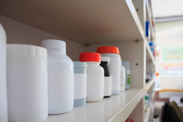 istock medicine bottles arranged on shelf at drugstore 828299400