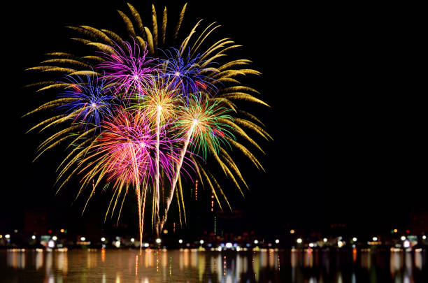 istock Colorful fireworks celebration and the city night light background. 828306626