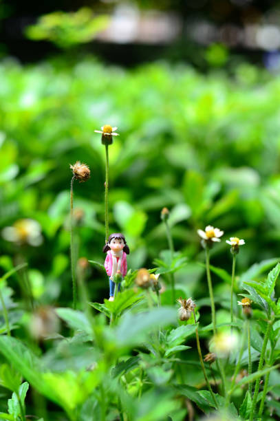 istock Explorer Girl in the forest - miniature people 828310332
