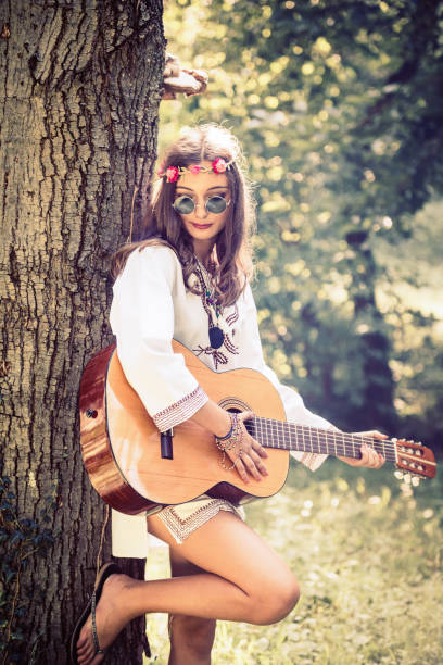 istock Hippie woman with guitar 828310850