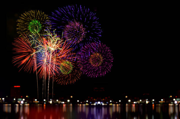 istock Colorful fireworks celebration and the city night light background. 828317884