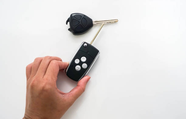 istock isolated people hold car modern remote control replaced the broken old remote control 828334026