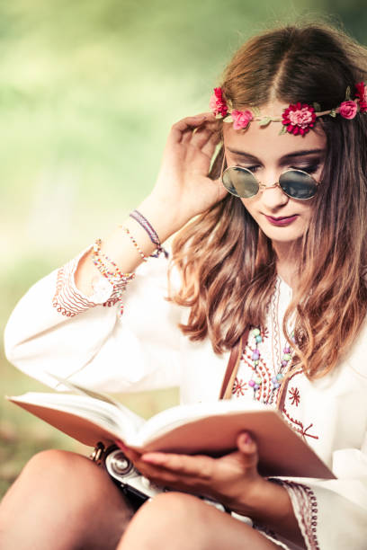 istock Hippie woman reading book 828341456