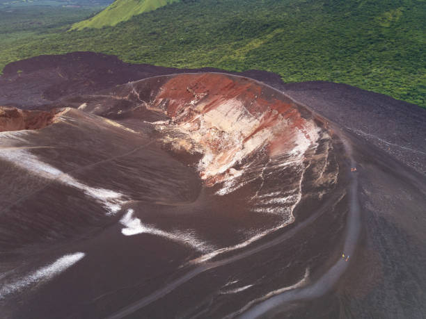 istock People walking on volcano crater 828345534