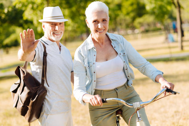 istock Positive delighted couple spending free time on nature 828368738