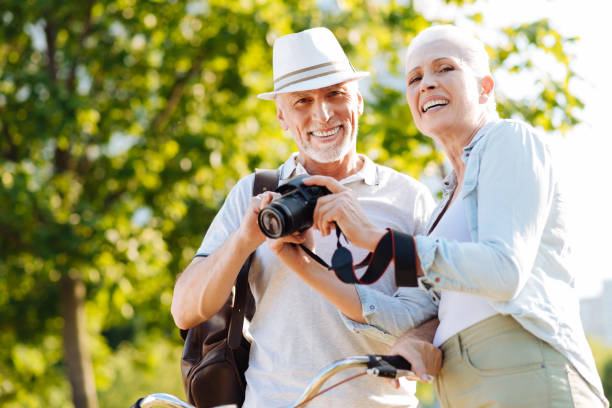 istock Smiling elderly people looking straight at camera 828369650