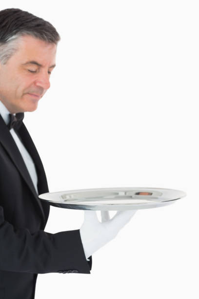 istock Waiter looking and holding a silver tray 828369862