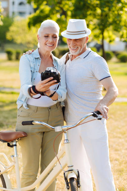istock Horizontal picture of elderly sweethearts while posing on camera 828370032