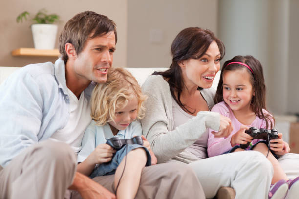 istock Competitive family playing video games together 828372236
