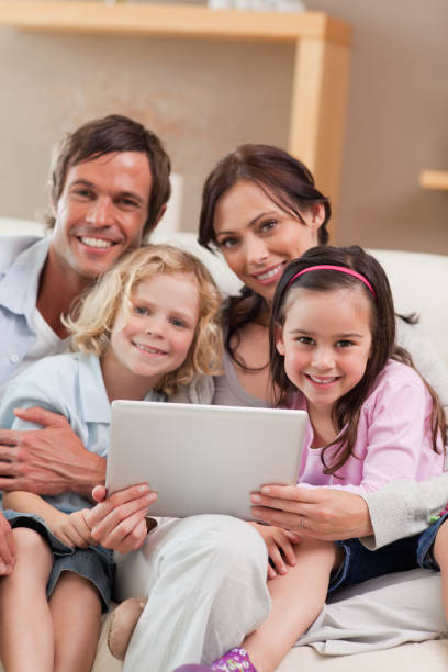 istock Portrait of a family using a tablet computer 828372494