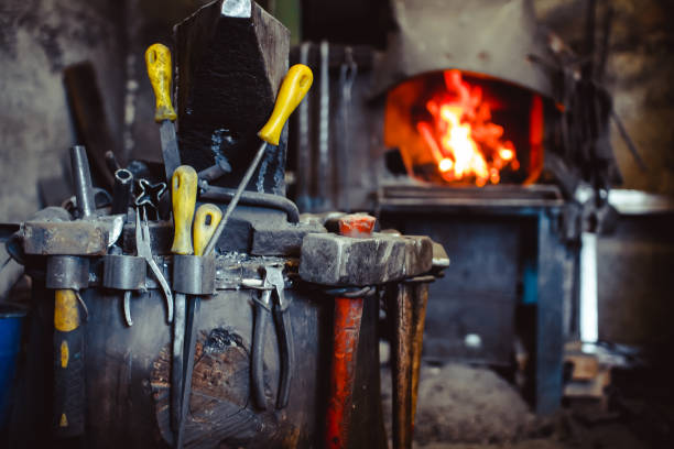 istock Fire in the furnace in the smithy, tools 828376584