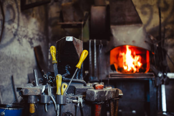 istock Fire in the furnace in the smithy, tools 828376630