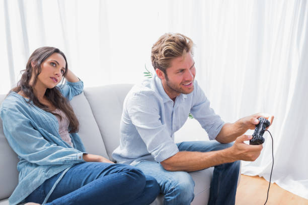 istock Woman annoyed that her partner is playing video games 828376694