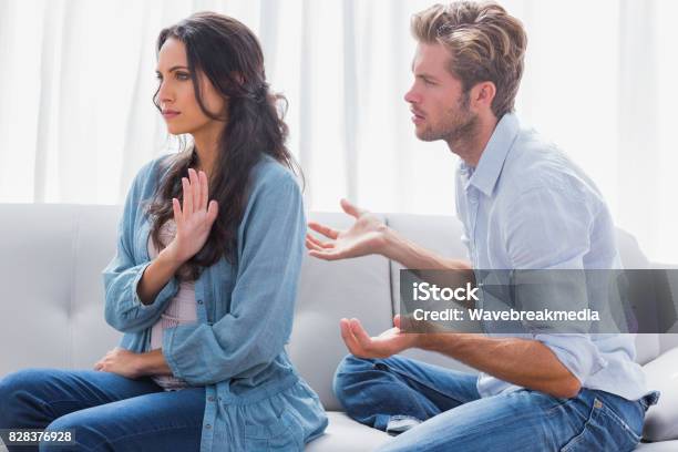 Woman Gesturing While Quarreling With Her Partner Stock Photo - Download Image Now - 20-24 Years, 30-34 Years, 30-39 Years